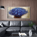 3D Floral Knife Canvas Art featuring vibrant blue flowers, adding depth and texture to a modern living room with a black leather sofa.