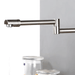 Wall-mounted swivel kitchen mixer with dual-function sprayer in stream mode, ideal for modern kitchen functionality and flexibility.