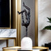 Abstract metal sculpture on marble base, Giacometti-inspired design, modern handcrafted art for home or hotel decor.