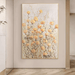 Hand-painted floral canvas art with orange and gold abstract flowers, showcasing textured brush strokes and earthy tones.