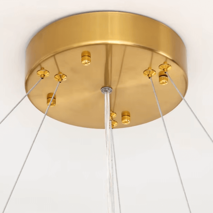 Gold ceiling mount detail of circular crystal LED chandelier for elegant home lighting.