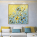 Abstract 3D floral knife painting with vibrant yellow and blue hues, featuring textured blossoms, displayed on a living room wall.