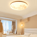 Modern bedroom with Japanese Moon Ceiling Lamp casting warm, diffused light, creating a serene atmosphere.