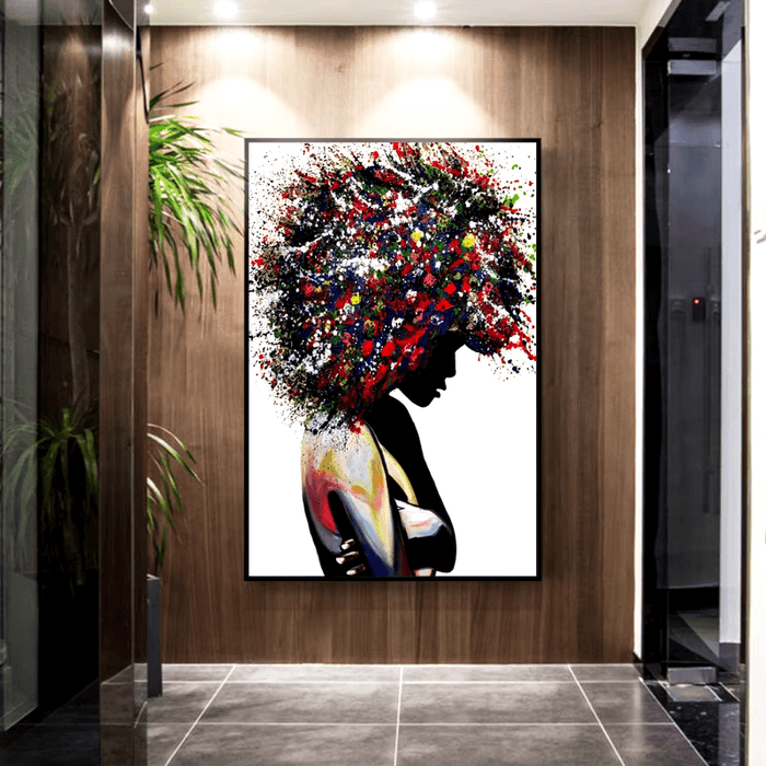 Vibrant Afro Abstract Canvas Art featuring colorful silhouette of a woman with dynamic afro, displayed on wood-paneled wall.