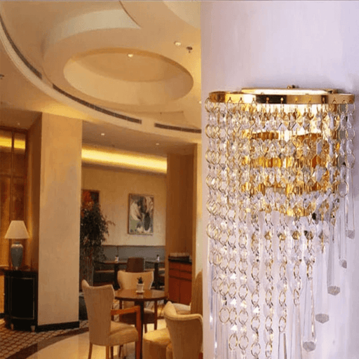 Elegant crystal wall sconce in modern interior with luxurious lighting and premium hardware decor.