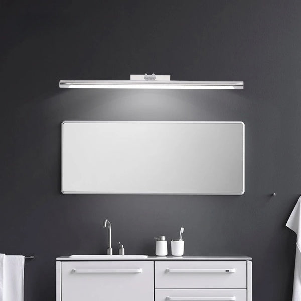 Sleek LED Vanity Mirror Light in modern bathroom setting with black wall, offering stylish and efficient illumination.