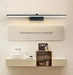 Modern LED aluminum wall light above bathroom vanity with mirror.