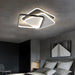 Modern overlapped LED ceiling light in a contemporary bedroom setting.