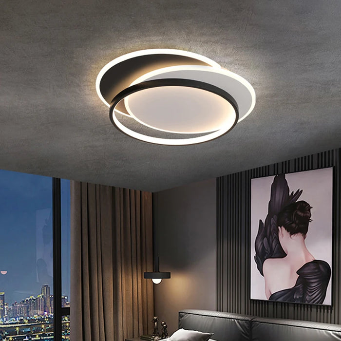 Modern overlapped LED ceiling light illuminating a stylish room interior.