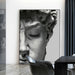 Black and white David of Michelangelo canvas painting in modern living room setting, adding sophistication and elegance.