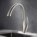 Sleek Pull-Out Sink Faucet with single-handle mixer on marble countertop, featuring a modern design and versatile sprayer.