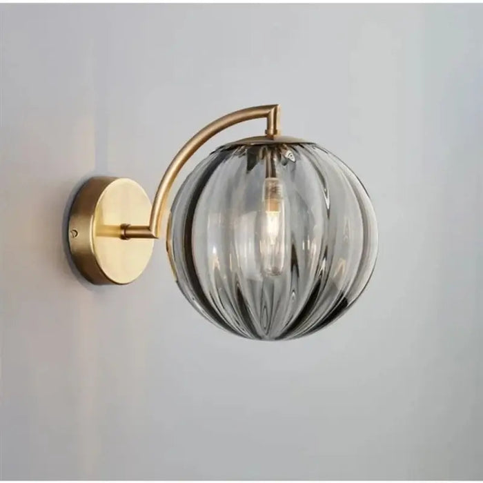 Nordic Glass Ball Wall Lamp with modern gold fixture and elegant glass design for stylish home interiors.