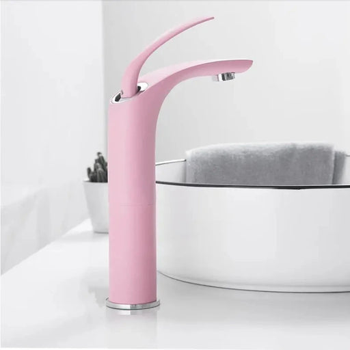 Pink Love Basin Faucet with contemporary waterfall design in modern bathroom setting.