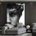 Luxurious black and white canvas of Michelangelo's David in elegant living room setting.