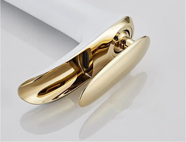 Elegant white and gold waterfall basin mixer faucet with single-handle design for luxurious bathrooms.