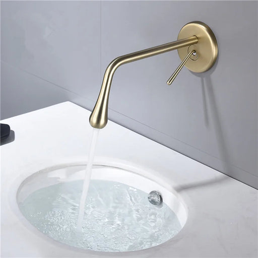 Elegant wall-mount water drop faucet in brushed gold; single-handle design above a white sink, ideal for modern bathrooms.