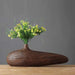 Modern stripe resin wood vase with yellow flowers, showcasing intricate line patterns and natural elegance on a wooden tabletop.