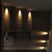 Modern indoor stairway illuminated by sleek wall lamps showcasing warm LED lighting, enhancing ambiance and safety.