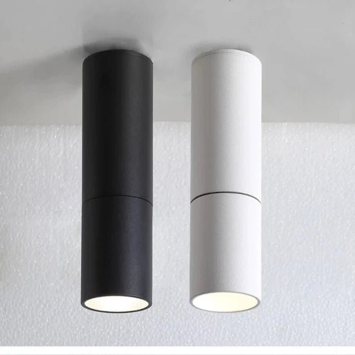 Black and white LED foldable spotlights mounted on the ceiling, made from durable aluminum with a modern design.