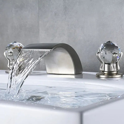 Crystal Handle Waterfall Faucet with Chrome and Golden Finishes in a Luxurious Bathroom Setting