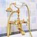 Luxury gold dual-control bathtub faucet with hand shower and swivel spout, crafted from brass, elegant design against tiled wall.