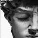 Close-up of Michelangelo's David sculpture in black and white, showcasing detailed craftsmanship and elegance on canvas wall art.