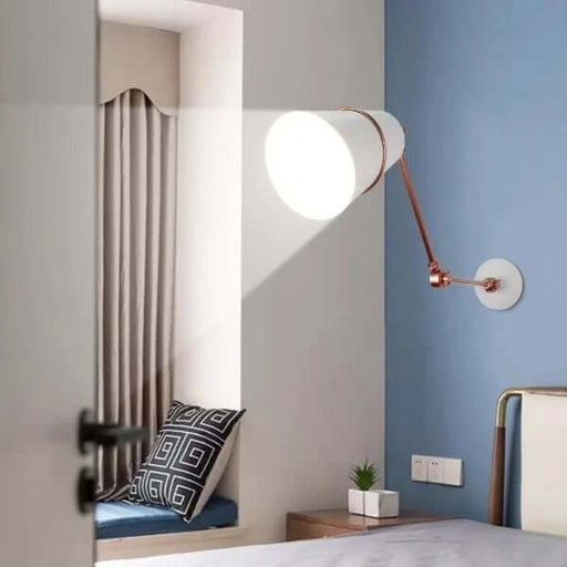 Modern Nordic long arm wall sconce illuminating a contemporary living space with pleated shade design in a minimalist setting.