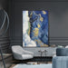 Abstract oil painting titled "The Blue Ocean" in a modern living room, featuring rich blue and gold hues on a vertical canvas.