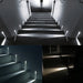 Modern LED wall lamps illuminating steps, showcasing indoor and outdoor versatility for stairway and walkway lighting.