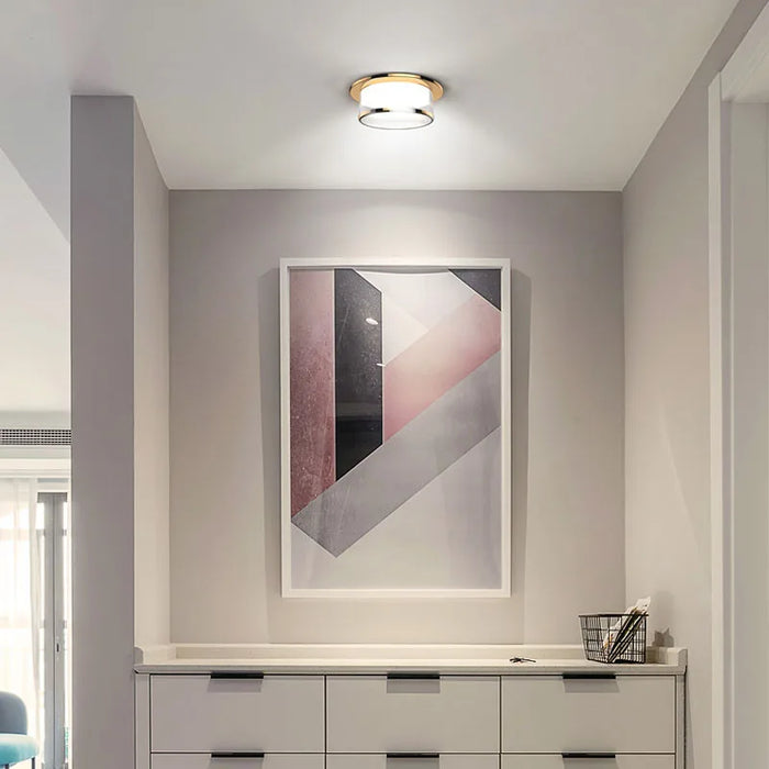 Crystal Ceiling Downlight Lamp illuminating a modern room with abstract wall art and sleek furniture.