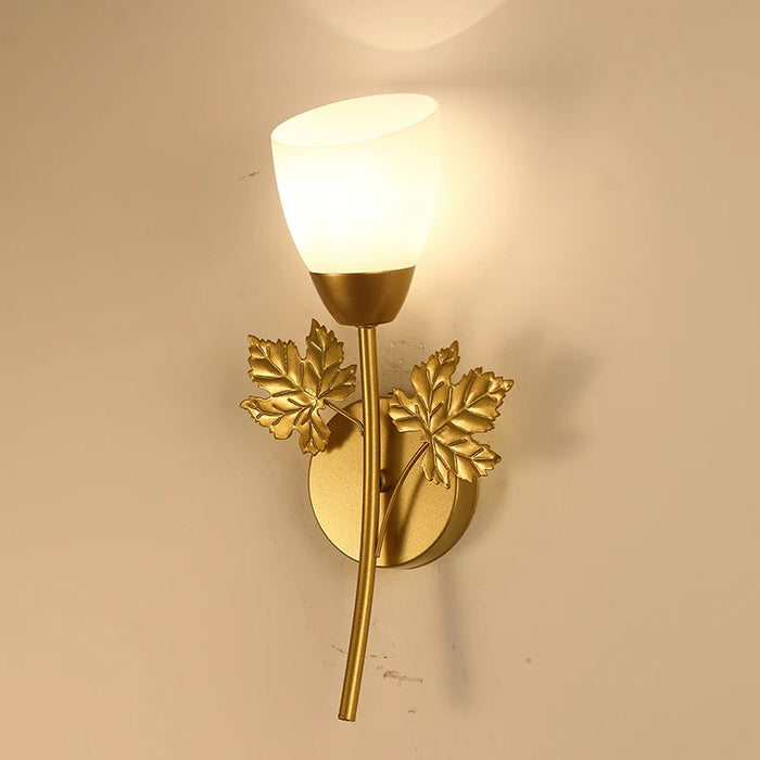 Modern Rose LED Wall Lamp with upward light, gold finish, leaf accents; ideal for bedrooms and studies; wide voltage range 110V-220V.