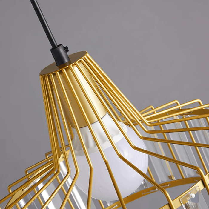 Modern caged glass pendant light with golden wire frame and exposed bulb design for elegant home decor.