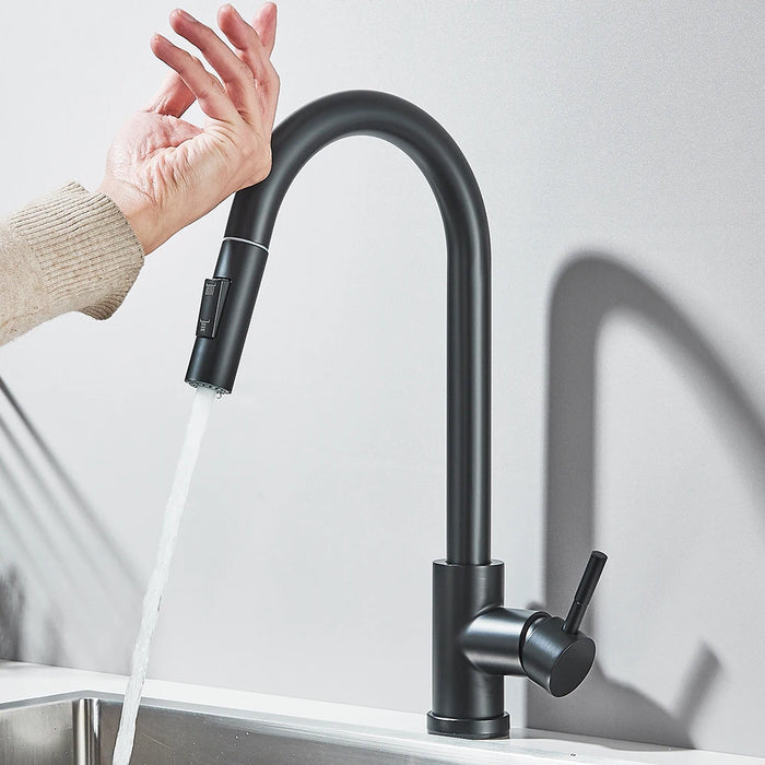 Black touch sensor kitchen faucet with running water, featuring hands-free operation for modern convenience and efficiency.