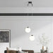 Modern round glass pendant lights in a living room with a sofa and decor elements, providing stylish LED lighting.