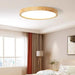 Ultra-Thin LED Nordic Wooden Ceiling Light in modern bedroom setting.