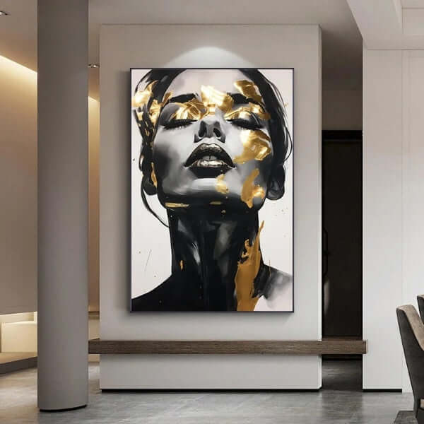 Elegant woman canvas art with black and gold accents in modern living room setting.