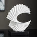 Modern spiral resin sculpture with elegant abstract design in white, perfect for home decor, displayed on a tabletop.