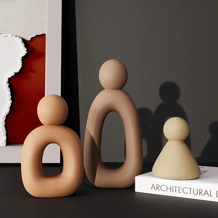 Modern abstract family sculpture set in Nordic style, featuring smooth, minimalist figurines for contemporary home decor.