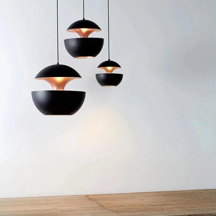 Modern black apple pendant lights with LED bulbs, showcasing stylish interiors for living or dining rooms.