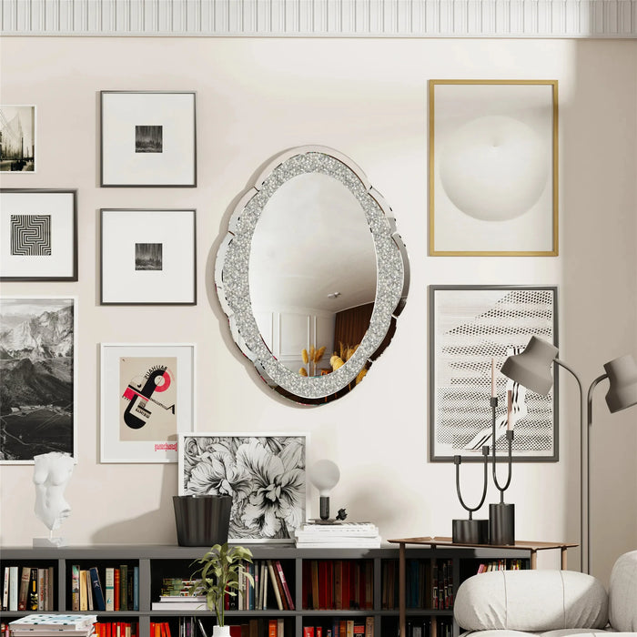 Elegant silver cloud-shaped wall mirror with crushed diamond frame, adding a modern artistic touch to a stylish living room.