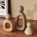 Modern Abstract Family Sculpture Set in beige tones on wooden shelf, symbolizing family unity and love in Nordic design.