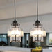 Tiered crystal glass pendant lights illuminating a modern kitchen with elegant LED lighting.