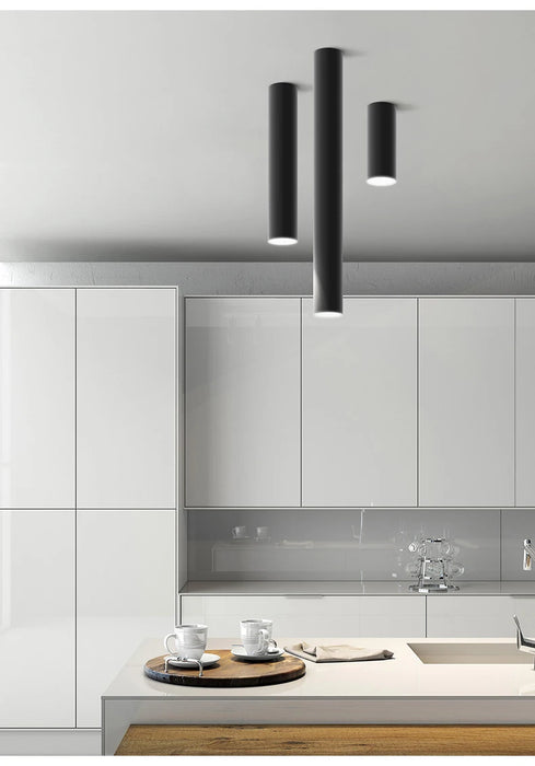 Modern kitchen with long tube LED ceiling lamps, featuring aviation-grade aluminum design for artful interiors.