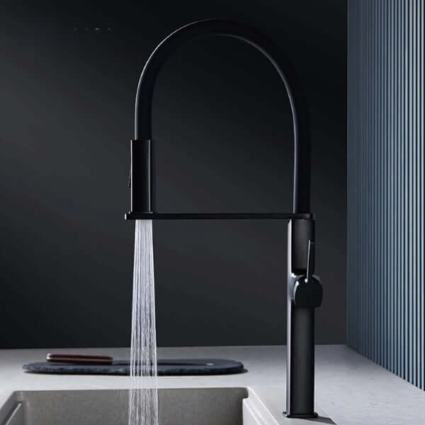 Luxury magnetic kitchen faucet with brass finish and dual-function spout in a modern kitchen setting.