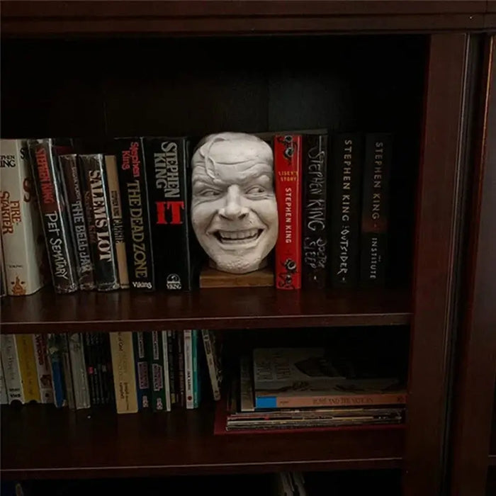 Shining-inspired realistic resin bookend on a bookshelf with Stephen King novels, adding horror charm to home décor.