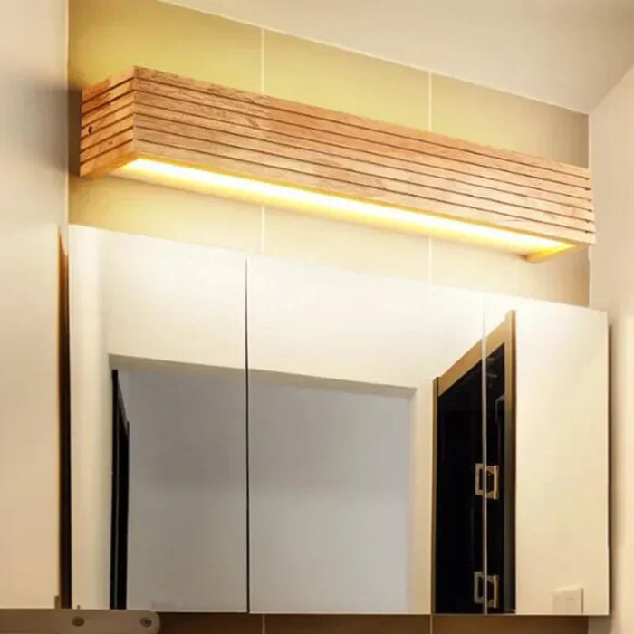 Elegant wood LED wall lamp above mirror, featuring adjustable design and premium materials for versatile lighting.