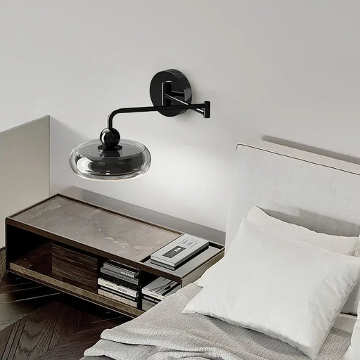 Italian Minimalist Swing Arm Wall Lamp in modern bedroom with sleek design and adjustable lighting above bedside table.