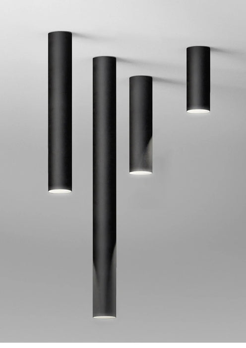 Long tube LED ceiling lamp in elegant black, ideal for artful spaces with aviation-grade aluminum finish and surface-mounted design.