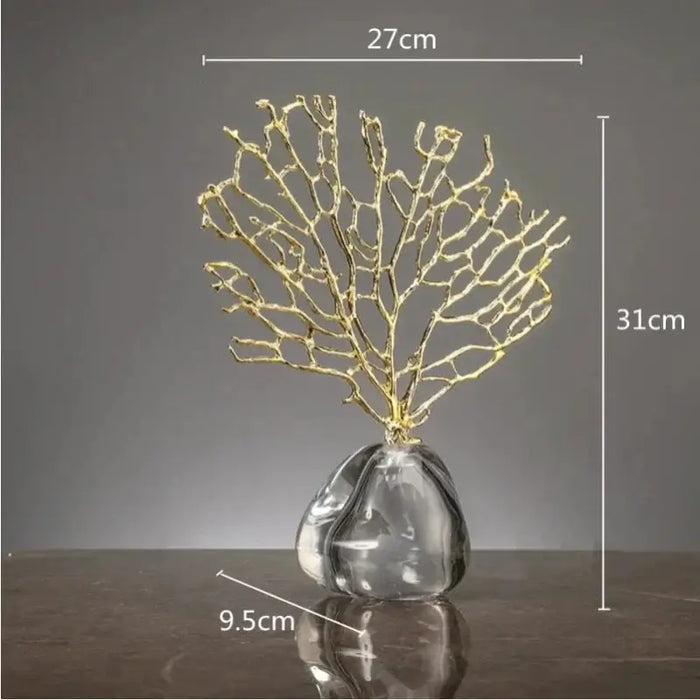 Golden coral reef ornament with a hollow metal design on a sleek crystal base, measuring 31cm high and 27cm wide.