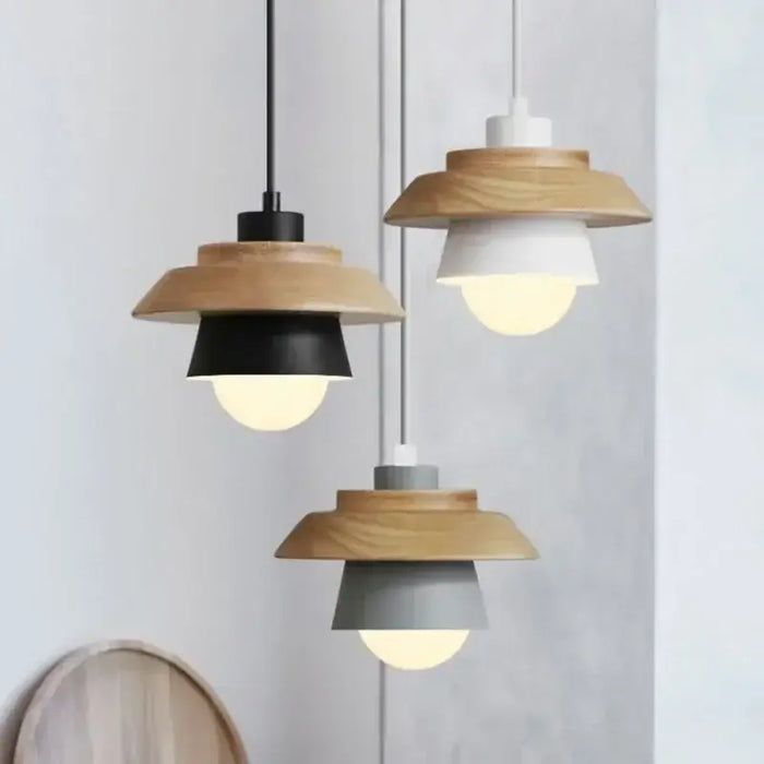 Nordic wood round pendant lights with colored shades, minimalist design, and wooden accent for cozy ambiance.